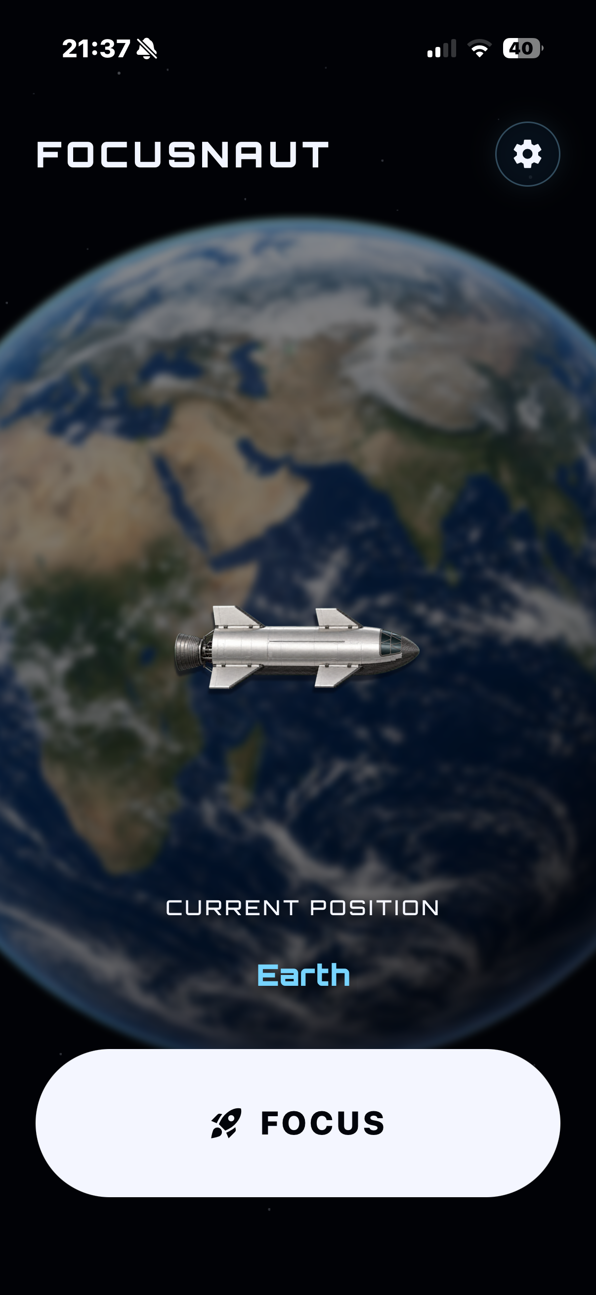 FOCUSNAUT running on an iPhone, showing Earth and the focus launch button